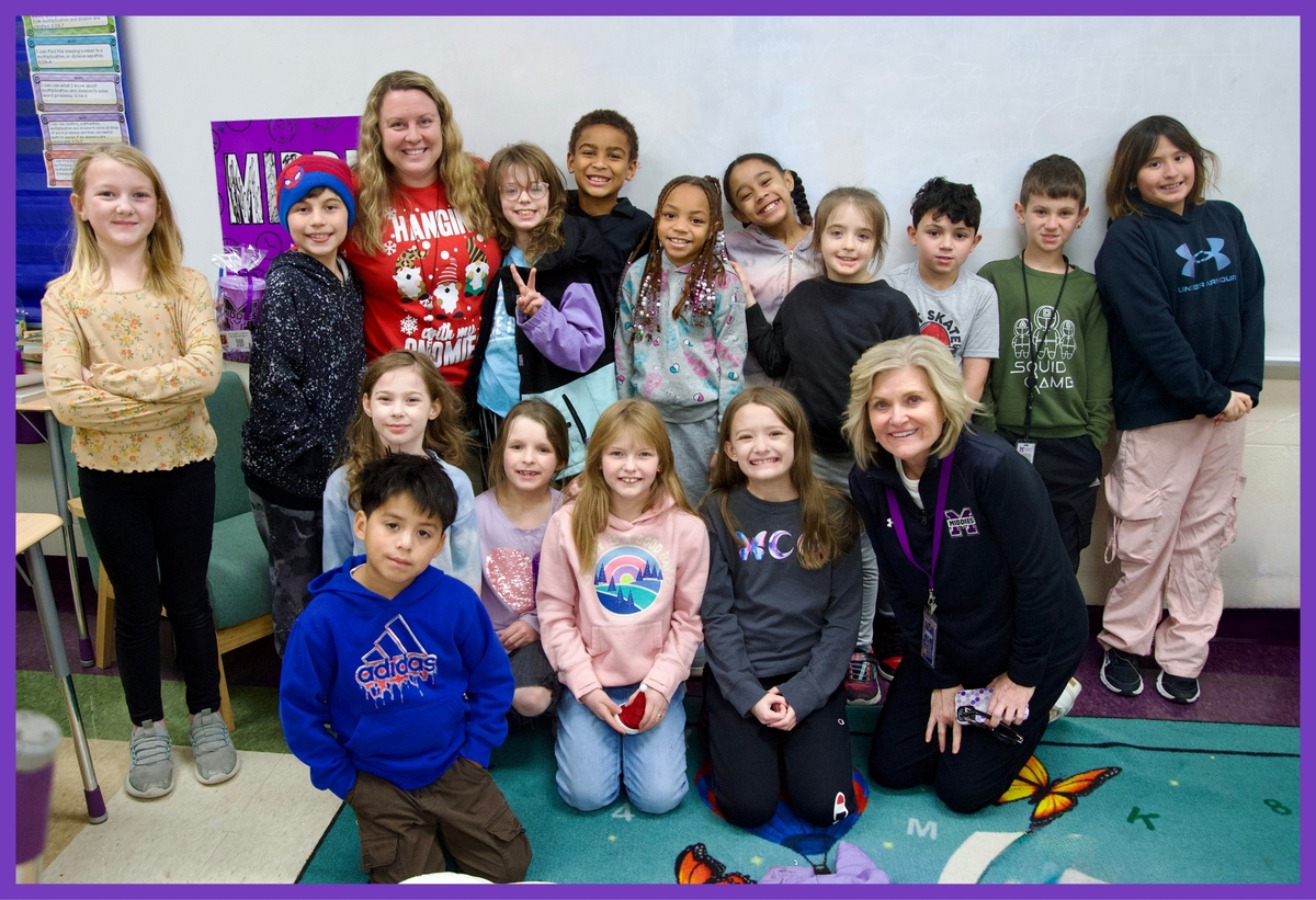 photo of superintendent with a group of students